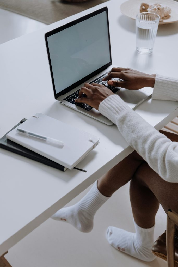  Illustrative image of Person Sitting Facing Laptop used in Accordemy®'s training on Advanced Business Blogging