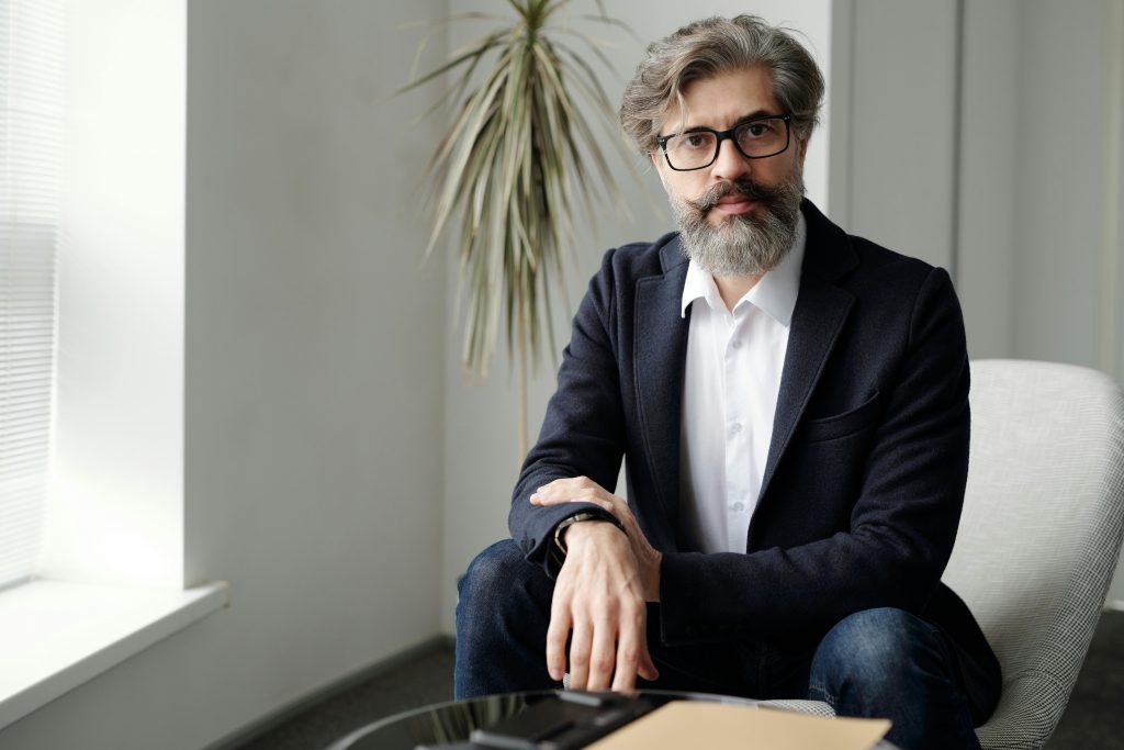 Illustrative image of Bearded Man in Black Suit Jacket
used in Accordemy®'s training onLeadership Styles that suit a manager.