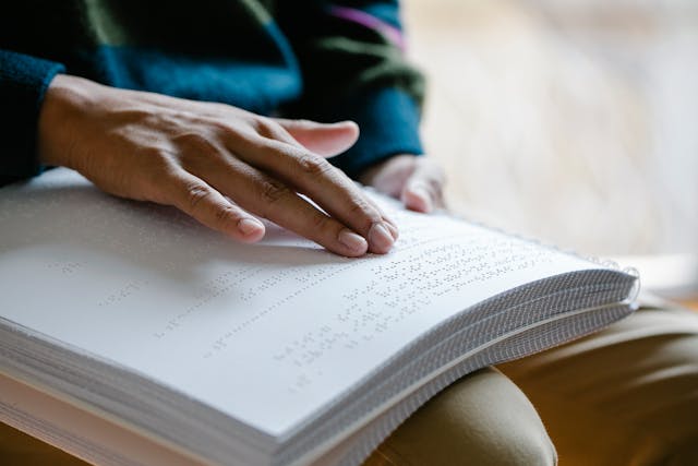 Illustrative image Close-Up Photo Of Person Using Braille  used in Accordemy®'s training on Sensitivity Training