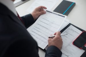 Illustrative image Person Holding a White Paper used in Accorademy®'s training on Inter-generational Workforce Management