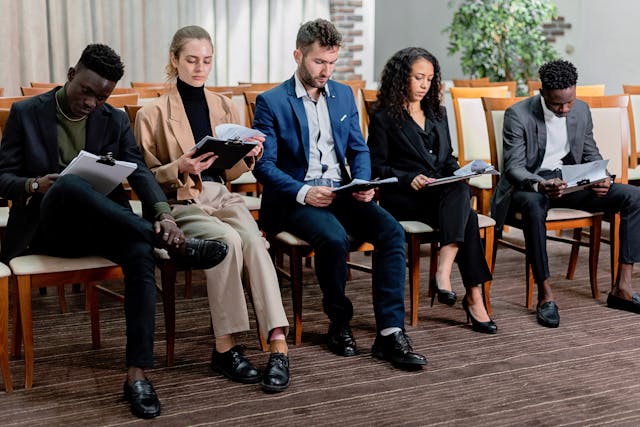 Illustrative image of A People Sitting While Reading Together
 used in Accordemy®'s training on HR Role in Crisis Communication