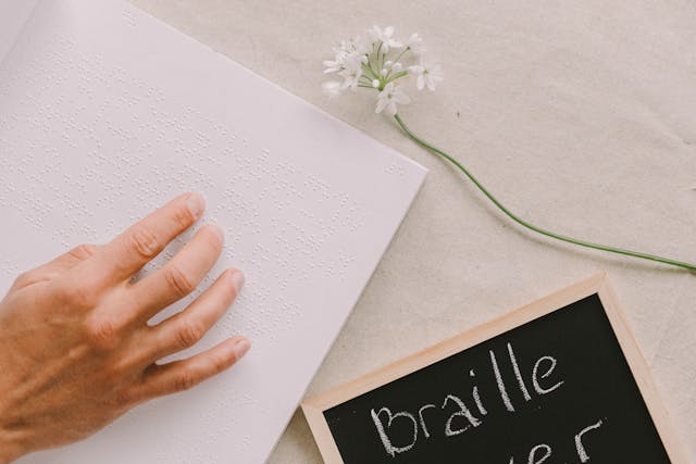 Illustrative image Close-Up Photo Of Person Using Braille  used in Accordemy®'s training on Sensitivity Training