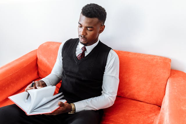 Illustrative image of Man in Black Vest and White Dress Shirt Sitting on Orange Sofa
used in Accordemy®'s training on HR Tech Stack Optimization