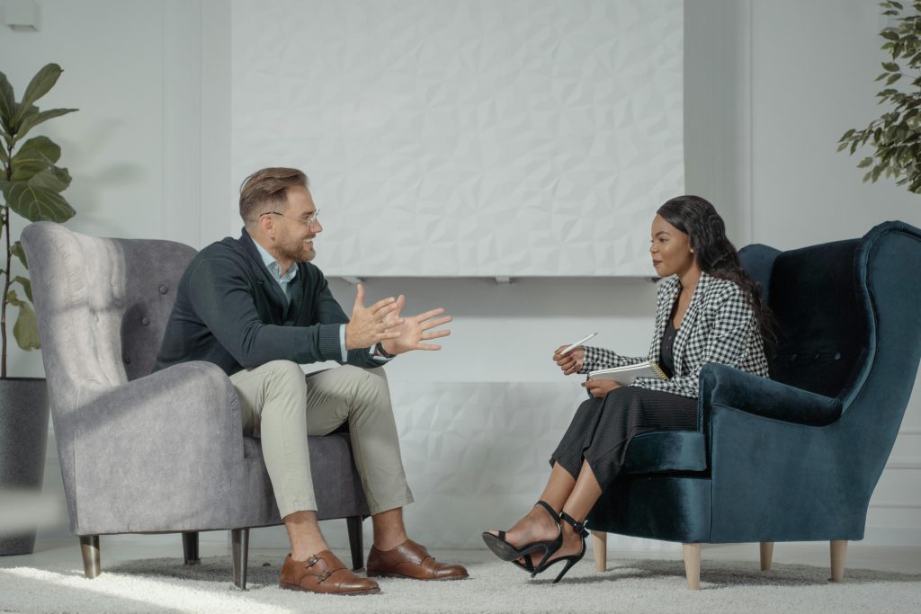 Illustrative image of A Woman Interviewing a Man
 used in Accordemy®'s training on Response To Tenders.