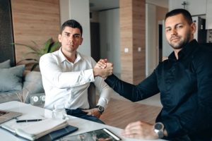Illustrative image A Two Businessman Doing Handshake used in Accordemy®'s training on Strategic Partnerships in Land Management