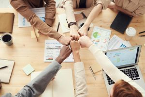 Illustrative image of Photo Of People Having Fist Bump used in Accordemy®'s training on Strategic Public Relations Management.