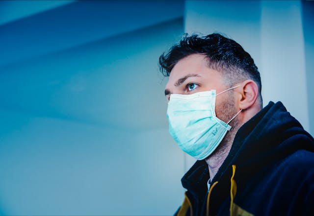 Illustrative image Man in Black and Yellow Jacket With Face Mask used in Accordemy®'s training on Infection Control and Prevention