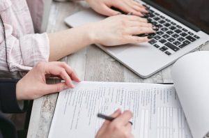 Illustrative image A Person Typing on Laptop used in Accordemy®'s training on Environmental Impact Assessment in Projects
