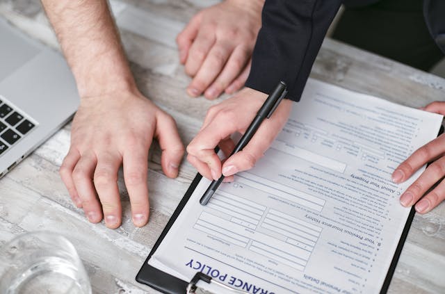Illustrative image A Person Holding a Black Pen used in Accordemy®'s training on International Contract Law