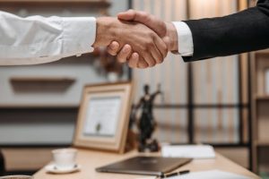 Illustrative image Close Up Photo of People Shaking Hands used in Accordemy®'s training on Logistics Performance Indicators and Analytics