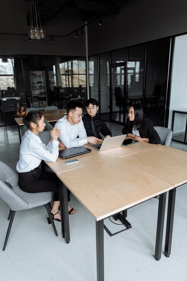 Illustrative image A Group of People Having a Meeting in the Office used in Accordemy®'s training on Financial Management for Project Managers