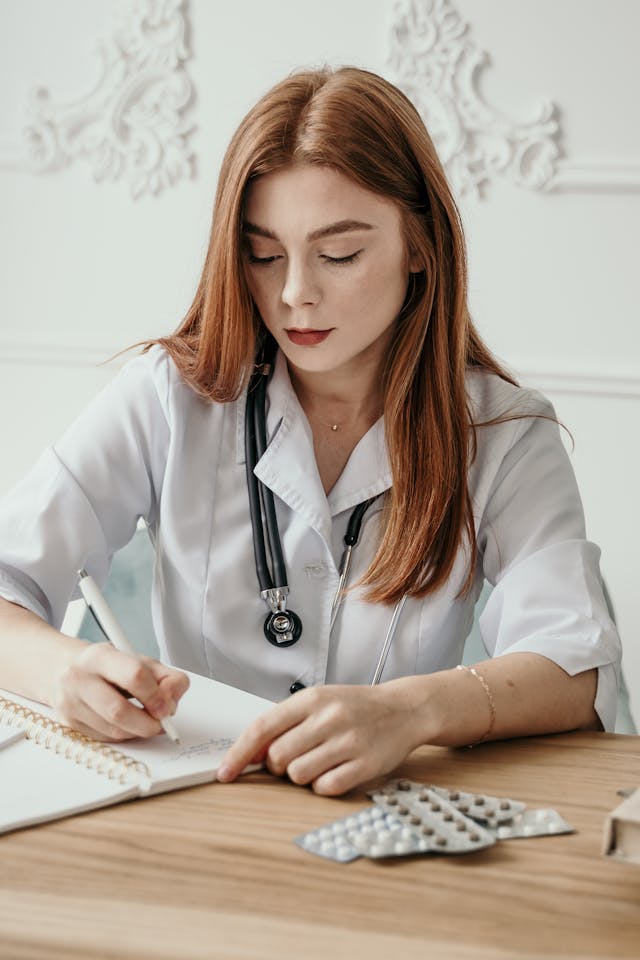 Illustrative image Doctor Writing a Note used in Accordemy®'s training on Report Writing Skills for Healthcare Workers