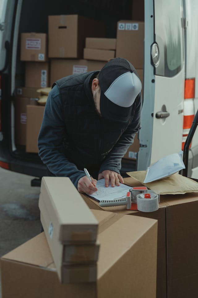 Illustrative image Man in Black Jacket and White Helmet Sitting on Chair used in Accordemy®'s training on Customer Service in Logistics and SCM
