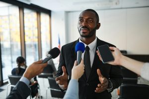 Illustrative image of A Man in Black Suit Having an Interview used in Accordemy®'s training on Strategic Media Relations.