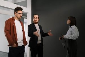 Illustrative image Colleague Having a Discussion while Inside a Building used in Accordemy®'s training on Virtual Team Building And Management
