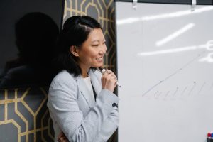 Illustrative image Female Employee holding a Pen used in Accordemy®'s training on Accordemy® Certified Trainer Level 1