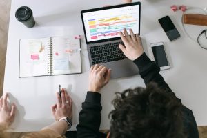 Illustrative image Person in Black Long Sleeve Shirt Using Macbook Pro used in Accordemy®'s training on Office Technology and Digital Tools