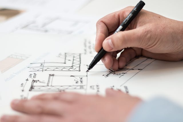 Illustrative image Person Holding Black Pen used in Accordemy®'s training on LFA and Project Planning