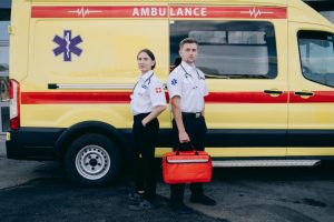 Illustrative image Paramedics Standing Beside an Ambulance used in Accordemy®'s training on Emergency Medical Response in Disaster Situations