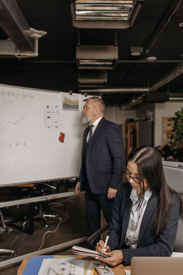 Illustrative image Man in Black Suit Jacket Standing Beside White Board used in Accordemy®'s training on Accordemy® Certified Trainer Level 1
