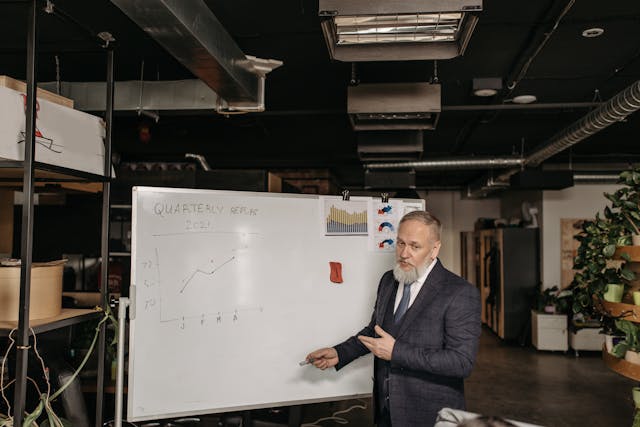 Illustrative image A Man in Corporate Attire Pointing used in Accordemy®'s training on Accordemy® Certified Trainer Level 5
