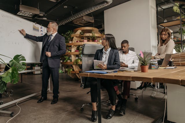 Illustrative image Group of People in a Business Meeting in an Office used in Accordemy®'s training on PPP for longterm development