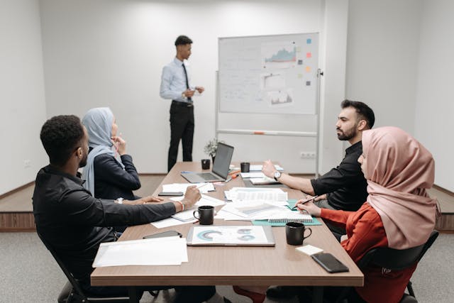 Illustrative image People Having a Meeting at the Office used in Accordemy®'s training on Master Trainer