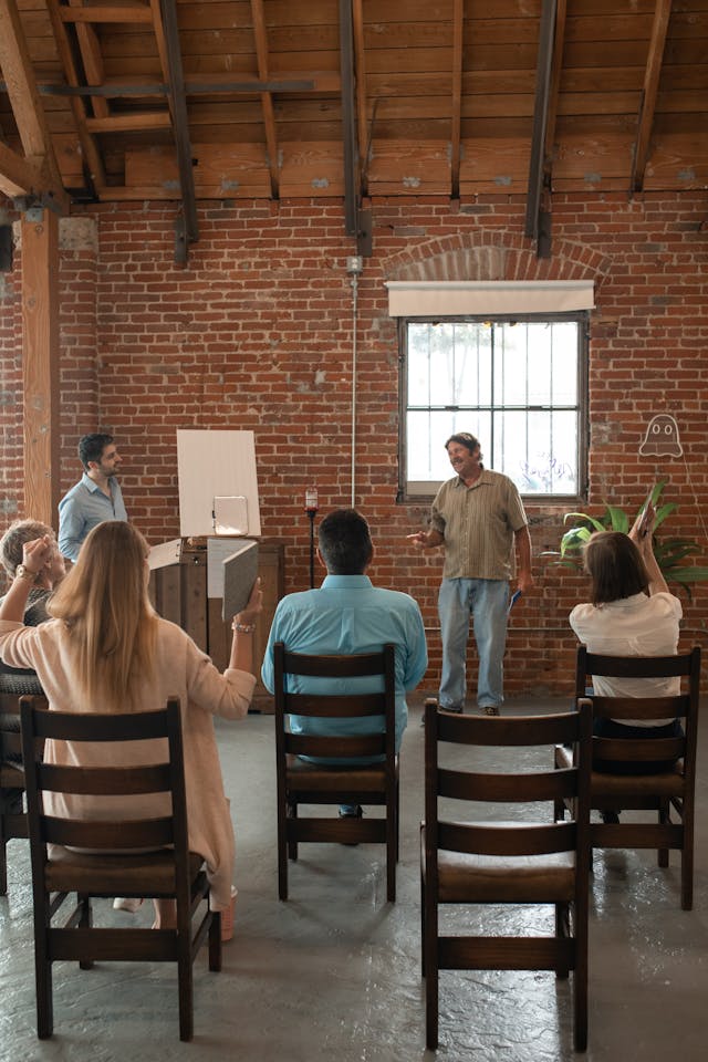 Illustrative image Adult Students Inside a Brick Building used in Accordemy®'s training on Advanced ToT: Comprehensive Course on Training of Trainers - TDP Level 2