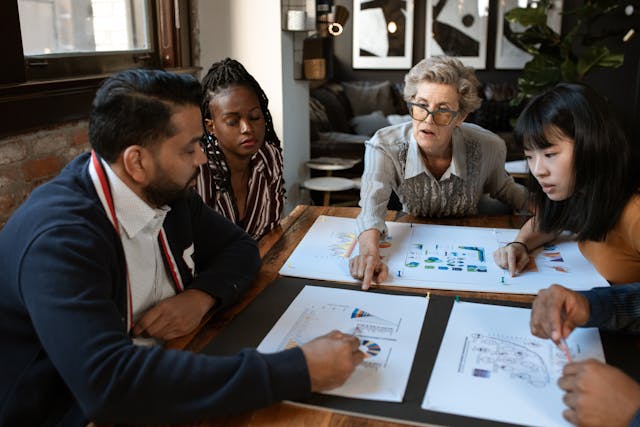 Illustrative image Man in Black Vest Sitting Beside Woman in Gray Sweater used in Accordemy®'s training on Leadership Development for Relief Workers