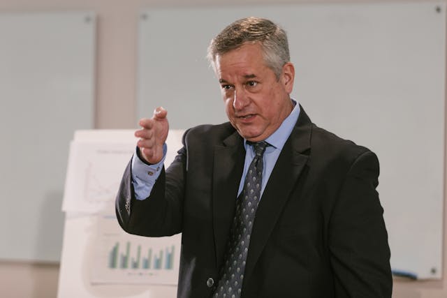 Illustrative image A Speaker in a Formal Wear used in Accordemy®'s training on Accordemy® Certified Trainer Level 3
